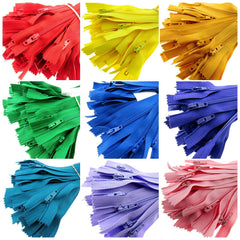 Bunches of closed end bylon zips in several bright colours,  Picture if arial view of a collage