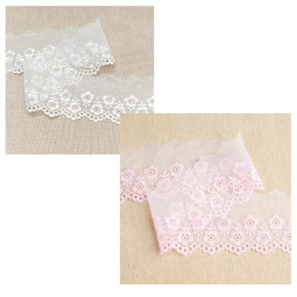 Two pieces of flat nylon lace in white and pink colors, laid out flat.