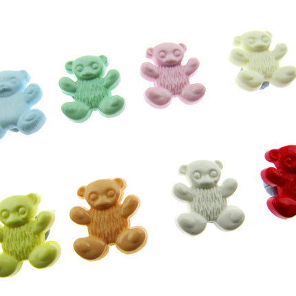 Assorted colorful teddy bear-shaped candies on a white background
