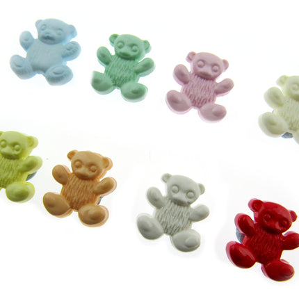 Colorful teddy bear-shaped candies on a white background
