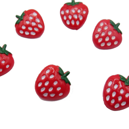Red strawberry-shaped buttons with green stems on a white background