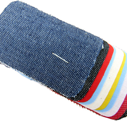 Ten iron on cotton patches on a white background