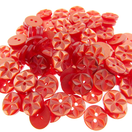 An array of colorful round star-shaped baby buttons in various colors including green, orange, pink, purple, yellow, and clear.