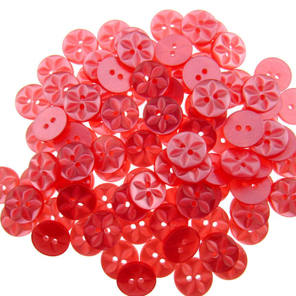 An array of colorful round star-shaped baby buttons in various colors including green, orange, pink, purple, yellow, and clear.