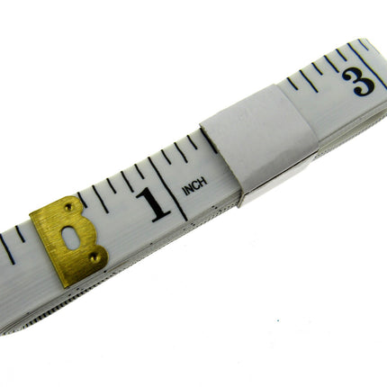 White measuring tape with black markings and gold measurement indicator on a white background