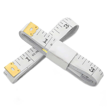 Two crossed tape measures with gold ends on a white background