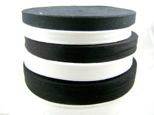 A collection of black and white cotton India tape on a white background