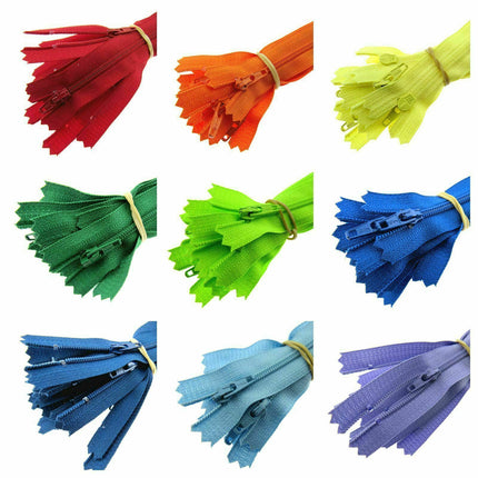 An assortment of YKK nylon closed-end zips in various solid colors, including red, orange, yellow, green, blue, purple, and their shades and combinations.