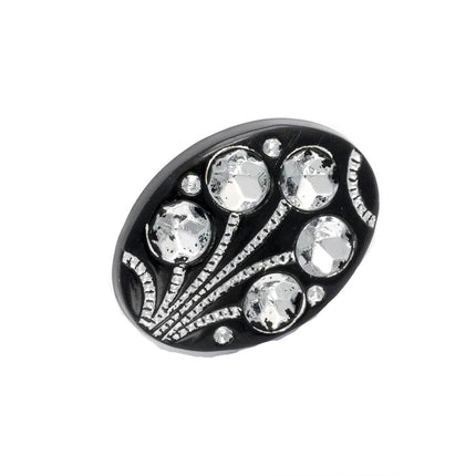 A black oval-shaped diamante flower shank button with multiple crystal embellishments.