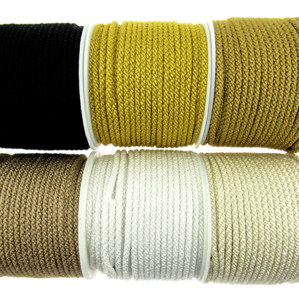 Assorted colors of rayon braided lacing drawstring cord, displayed in rolls.