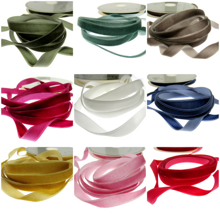 A collection of bright velvet ribbon on a white background