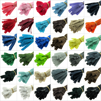 An array of YKK nylon closed-end zips displayed in multiple colors, with each group showing zips of the same color but in different lengths of 18", 20", and 22".